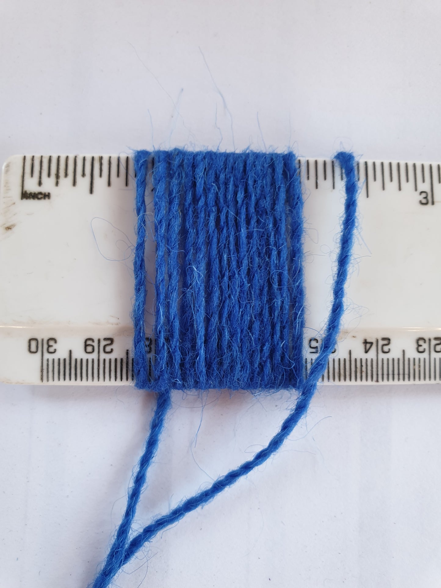 Royal Blue Rug Yarn showing wraps per inch