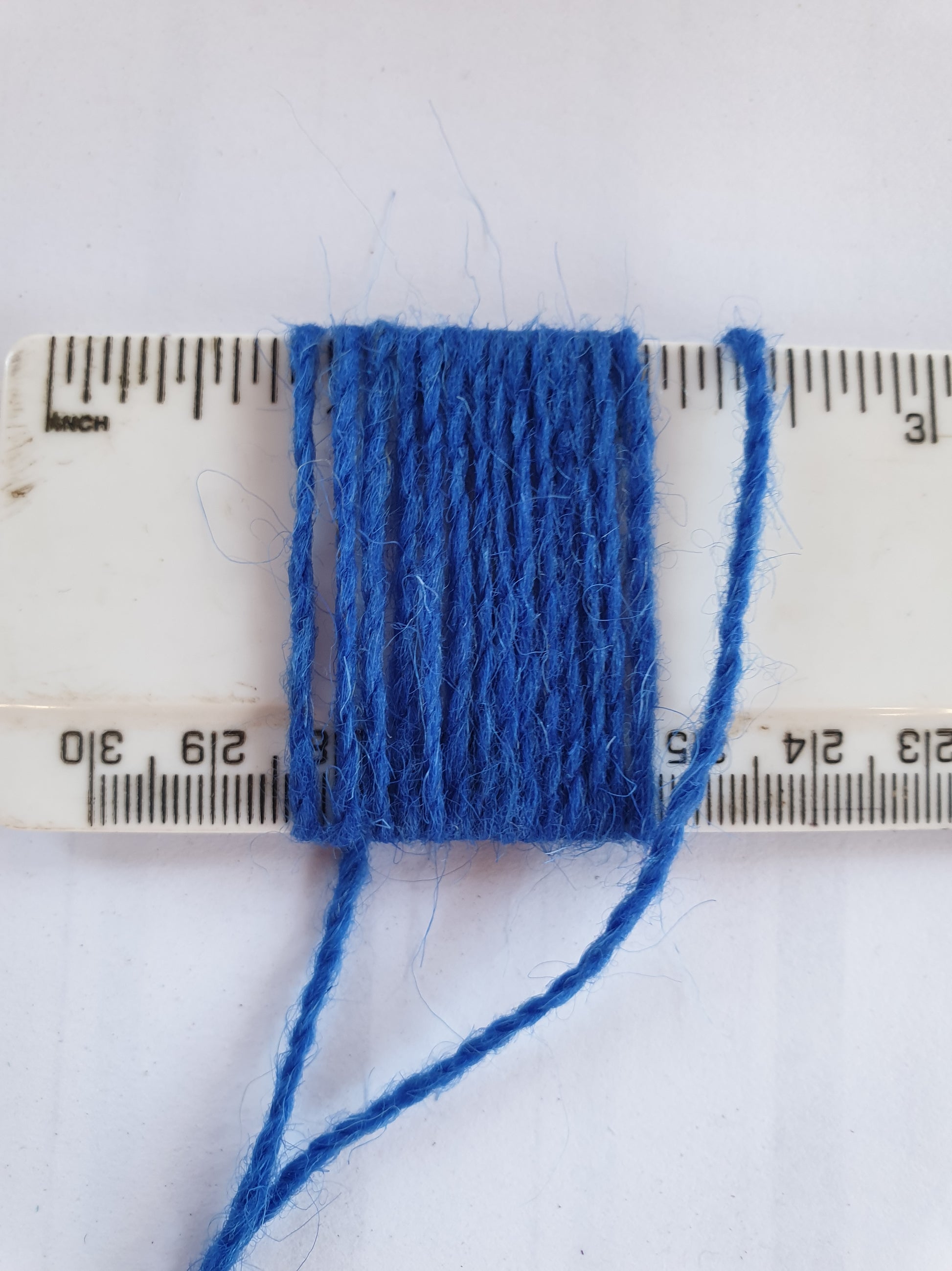 Royal Blue Rug Yarn showing wraps per inch