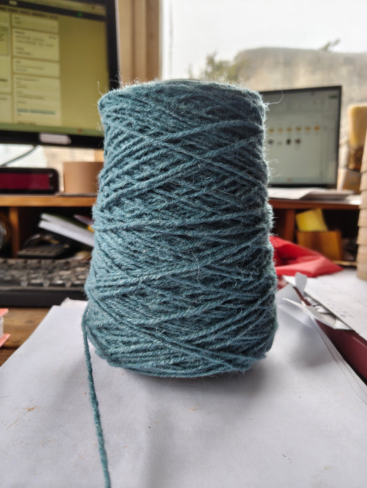 A cone of light sky blue weaving yarn
