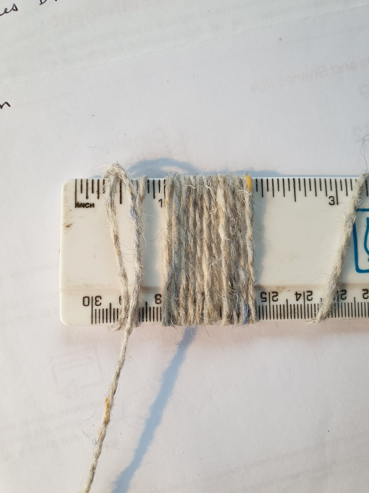 Light Grey Speckley rug yarn showing 11 wpi