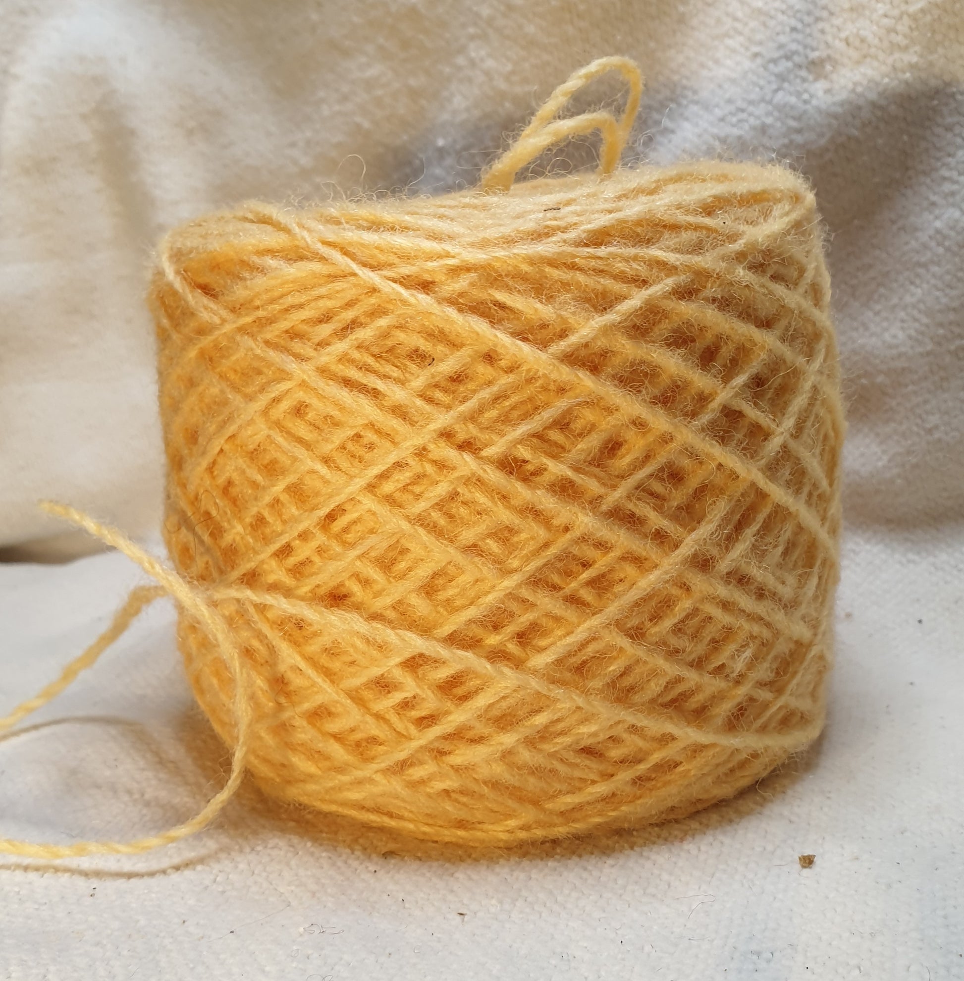 ball of custard yellow rug yarn