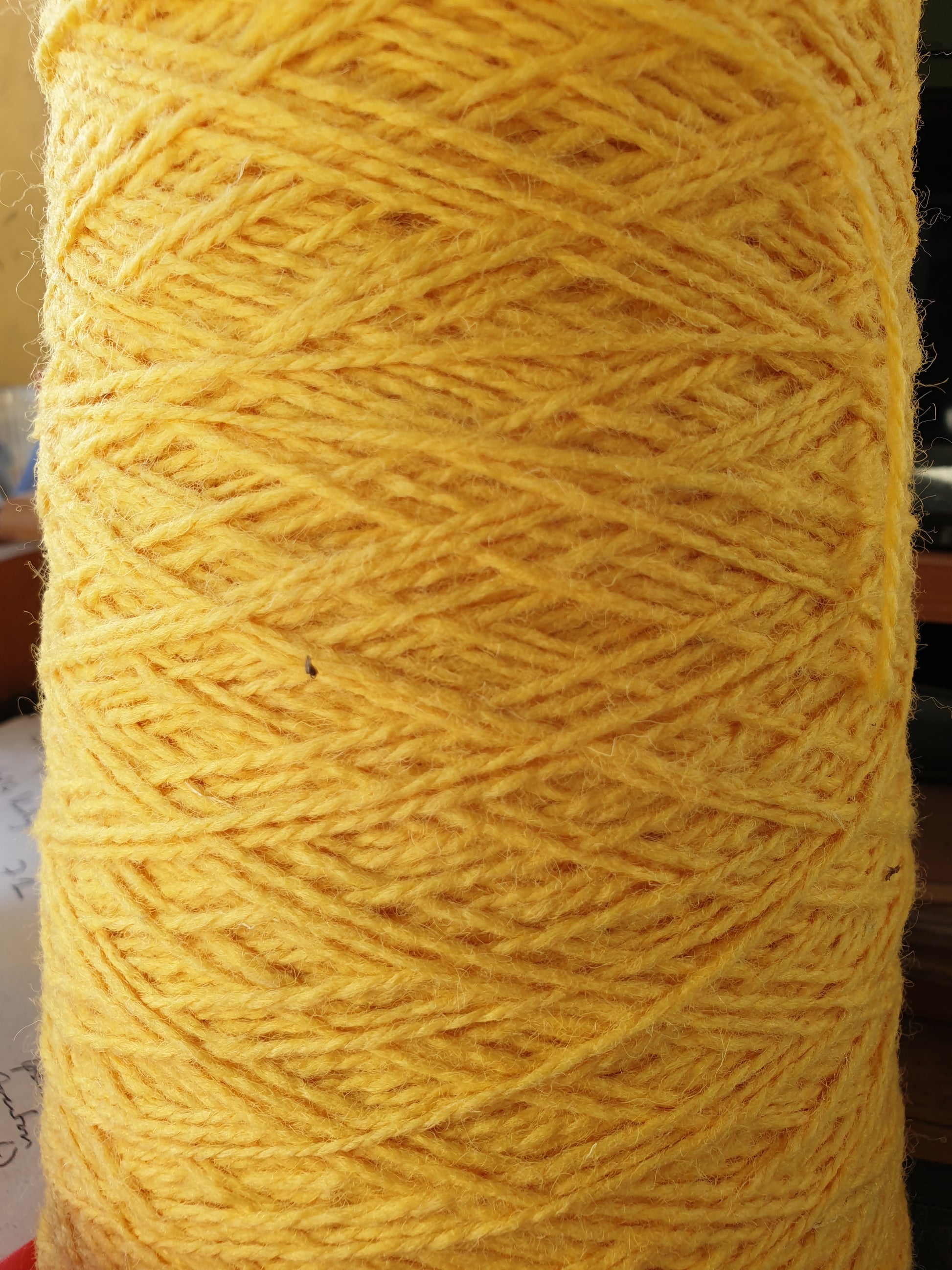 A close-up of Yellow Sunshine coloured rug yarn