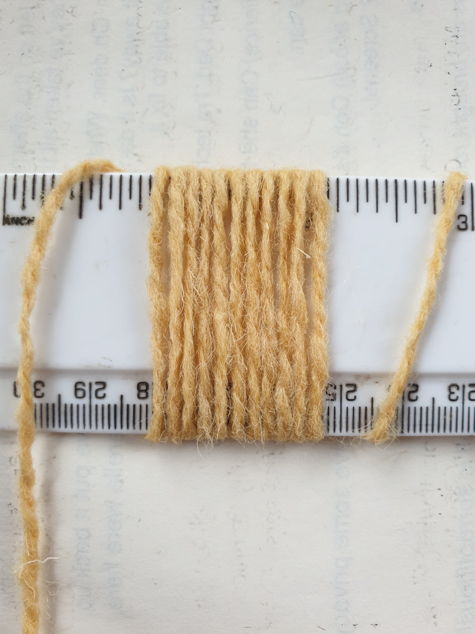 a thicker version of custard coloured rug yarn