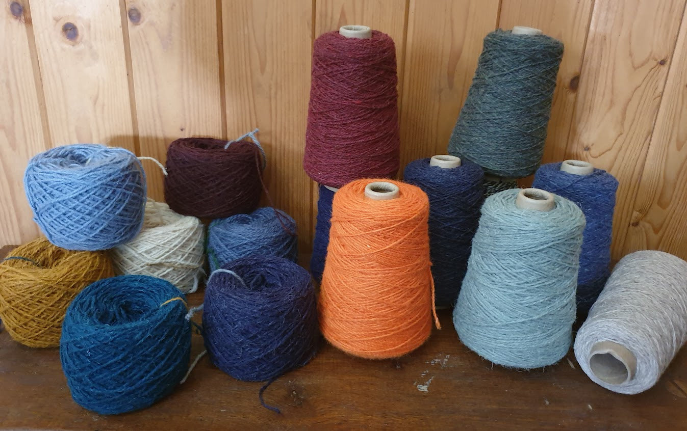 100g balls and 250g cones of Axminster Rug Wool in various colours