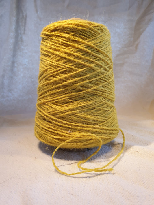 A Cone of Acid Yellow Rug Yarn
