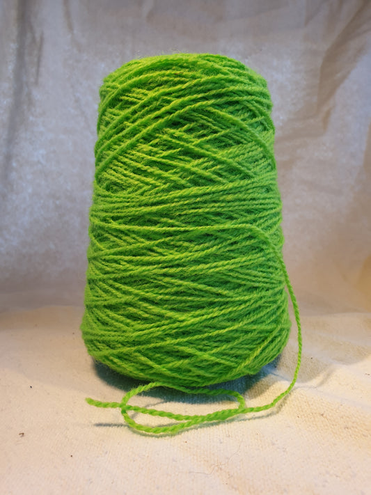 A cone of Lime Green Rug Yarn