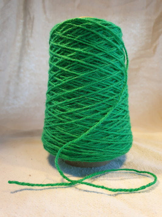 A cone of Emerald Green Rug Yarn