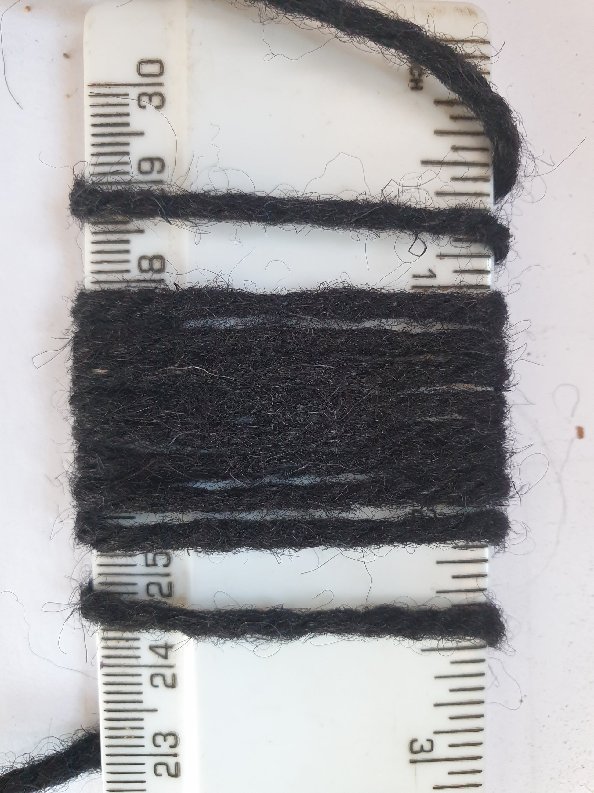 Thick black rug yarn