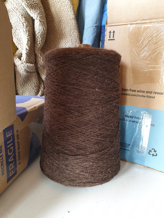 A large cone of very brown rug wool