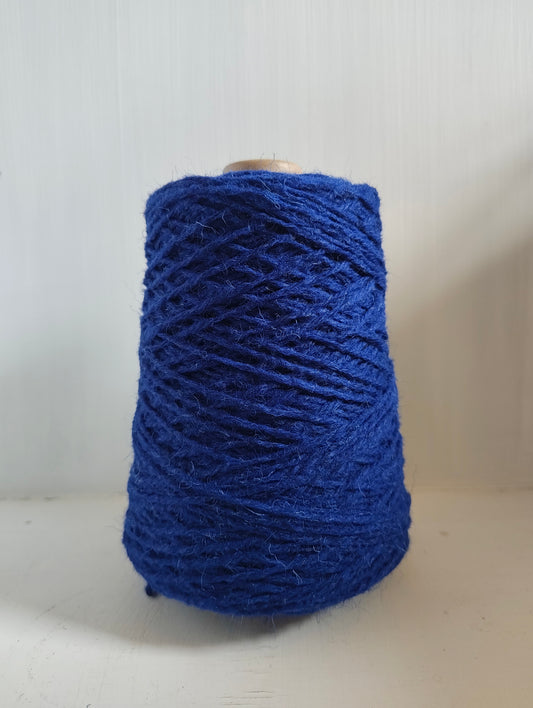 A cone of blue cobalt Axminster rug yarn