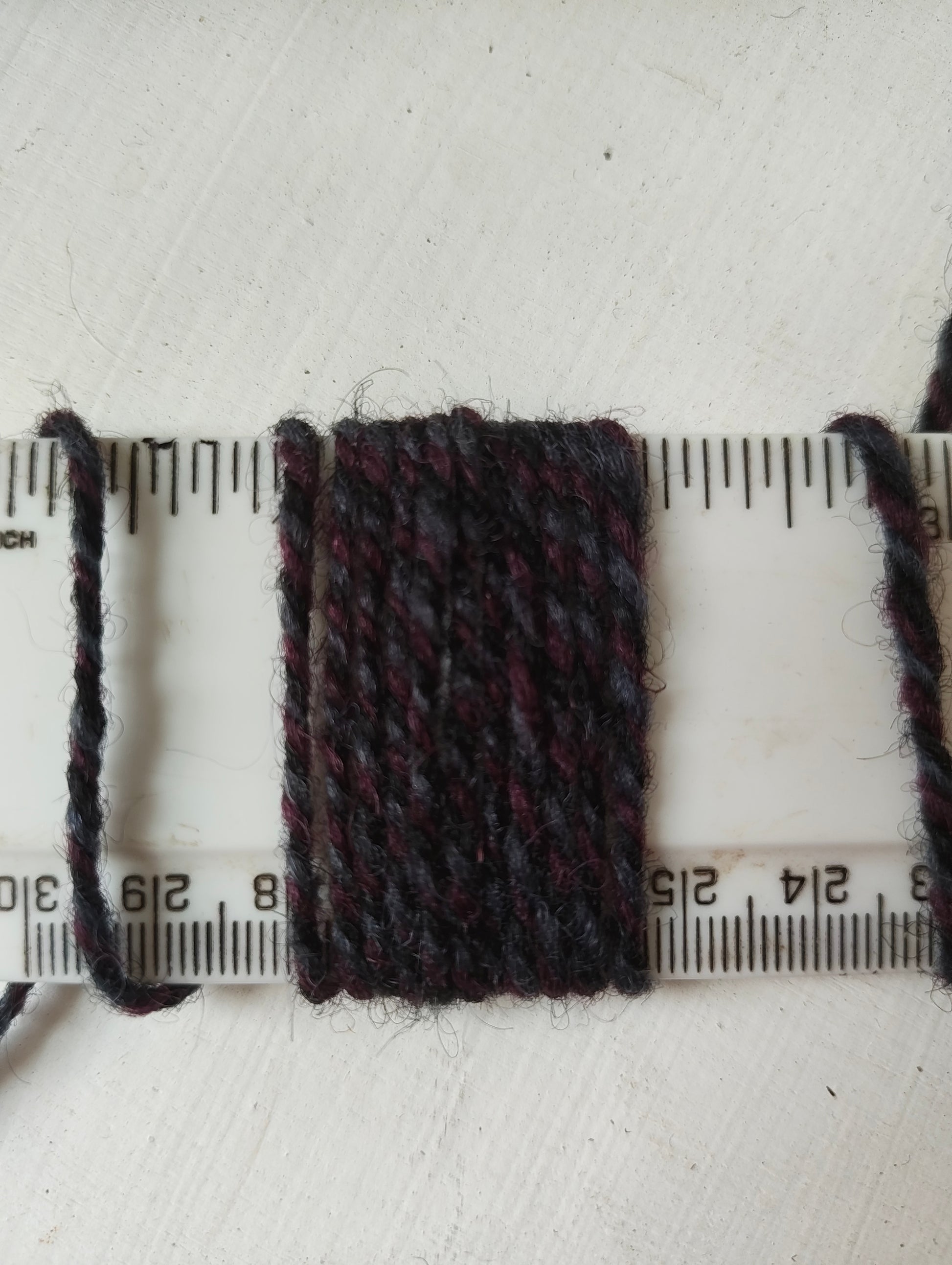 11 wraps per inch purple triple twist rug yarn