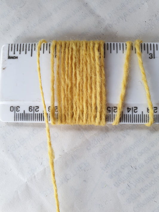 Yellow sunshine coloured rug yarn showing wpi